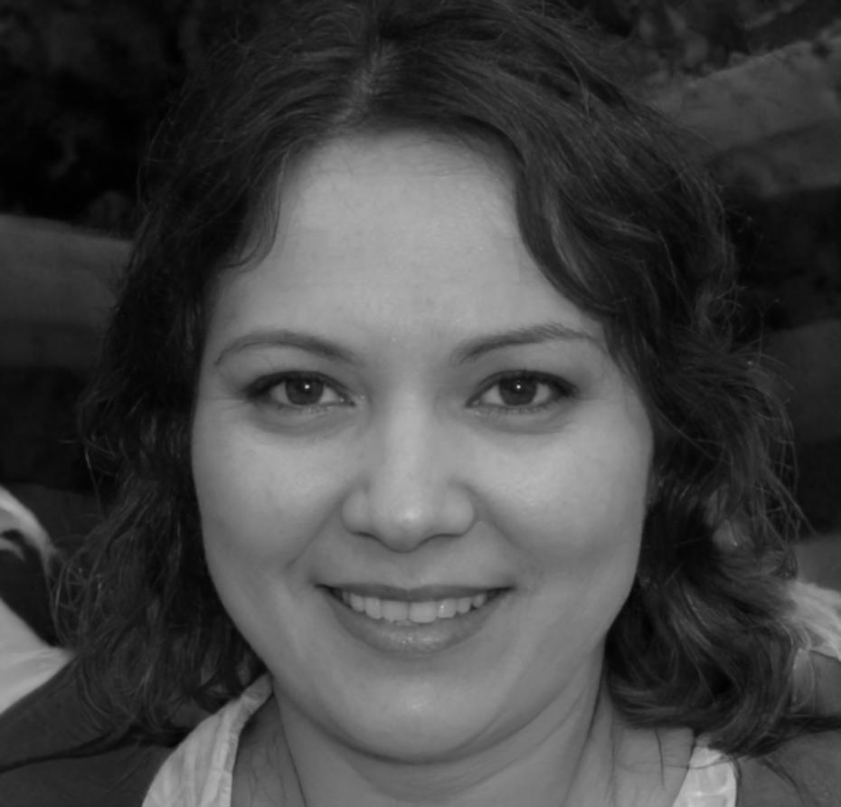 Financial instructor Linh Nguyen reviewing student work